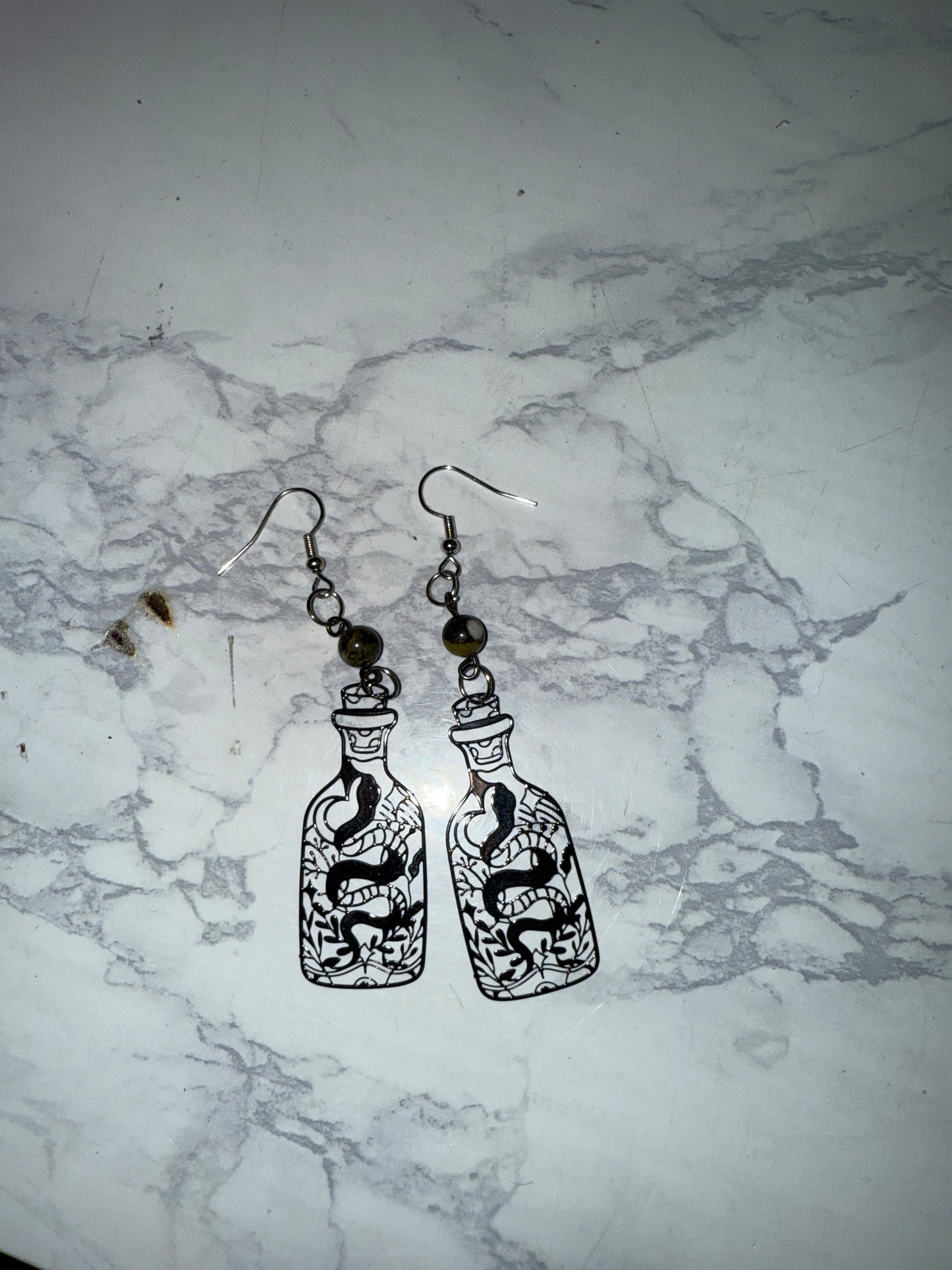 Dragons blood snake bottle earrings