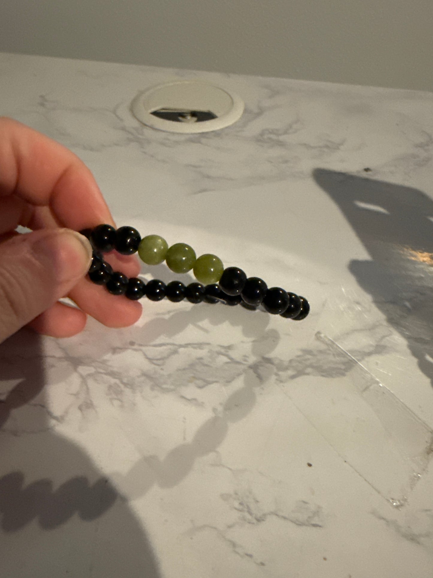 Green jade and black beaded bracelet